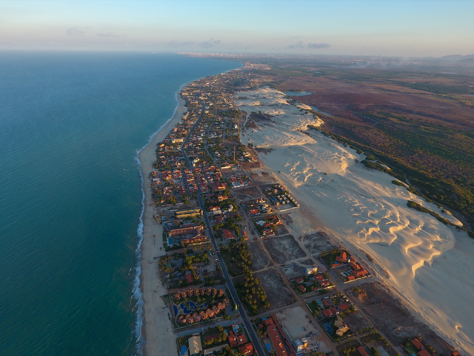 An aerial view of white sand and turquoise Indian Ocean water at Diani Beach, Kenya